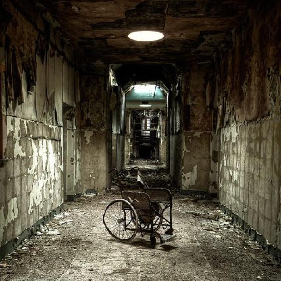Here is another lovely old abadoned hospital wheelchair ...