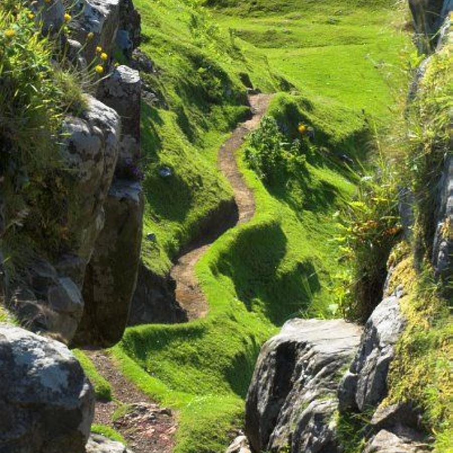 In my story, The Sacred Symbol, this happens to be winding up the Sierra del Torcal, but in reality it is Fairy Glen, on the Isle of Skye, Scotland. 