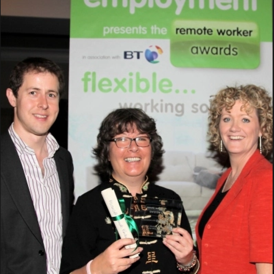 James McCarthy from Microsoft and Paula Wynne from Remote Employment celebrate with Shirley Pickford after she won the Remote Worker Awards.