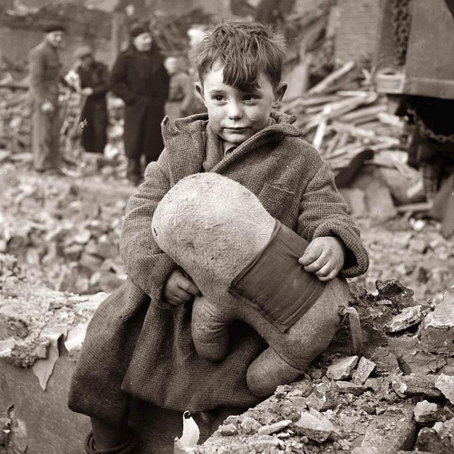 When looking for inspirational images to create my World War II character, I saw this young boy lost in the rubble of war and loved how he clung to his toy.